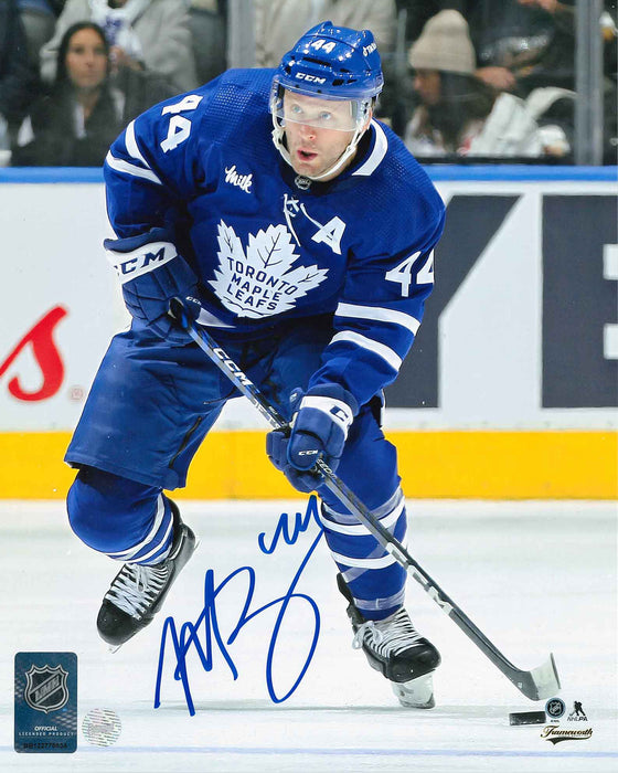 Morgan Rielly Signed Toronto Maple Leafs Blue Carrying Puck 8x10 Photo